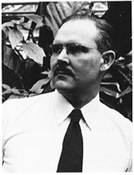 John Curtis standing in the UW Botany Greenhouses